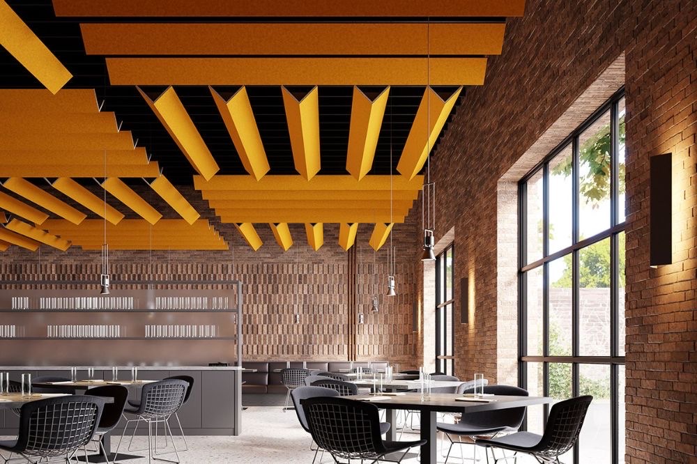 Café with amber acoustic baffles over the seating